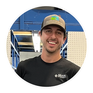 Photo of Nate Roark, wearing baseball hat and black t-shirt